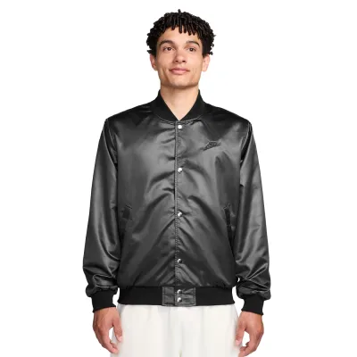 Front view of black satin Nike varsity jacket with snap closure and embroidered logo