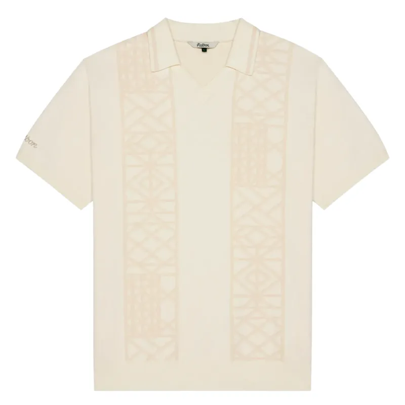 Flat lay of Malbon Habana Polo highlighting collar and sleeve embroidery