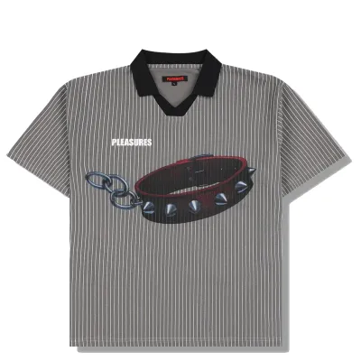 Front flat lay of PLEASURES Pet Polo featuring bold dog collar graphic with chain detail and PLEASURES logo text.