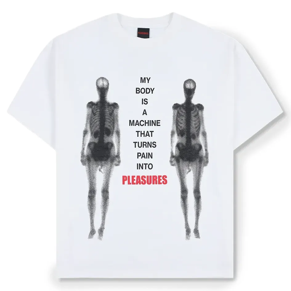 Front flat lay of white Pleasures Machine Tee with “My body is a machine that turns pain into Pleasures” graphic.