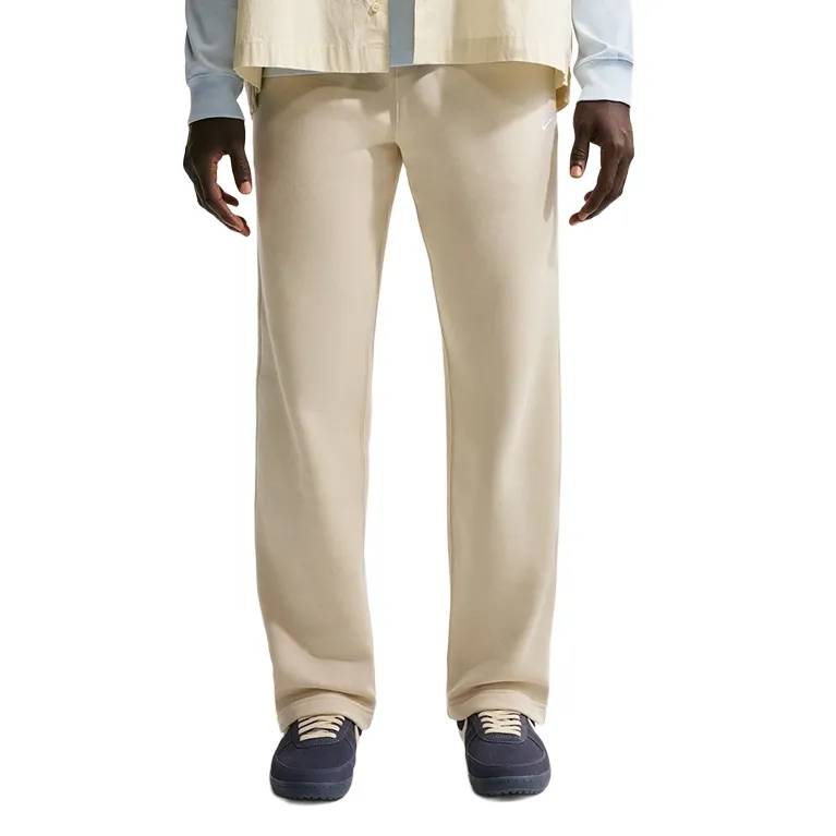 Front view showing relaxed fit and open hem resting over sneakers.