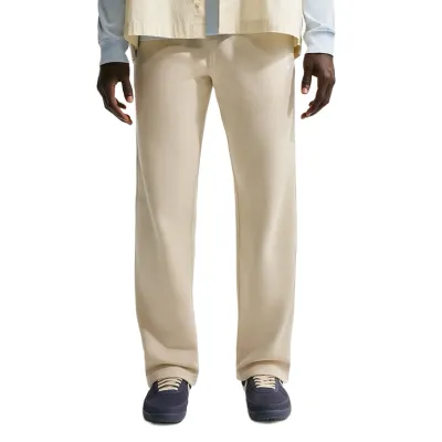 Front view showing relaxed fit and open hem resting over sneakers.