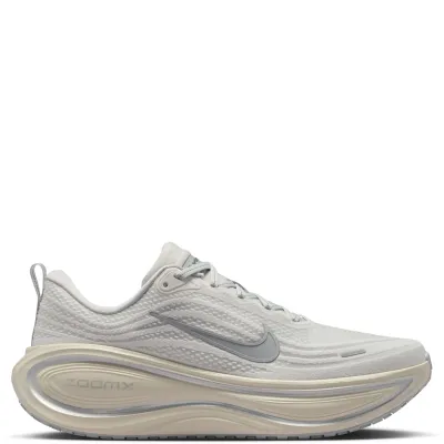 Medial side view showing layered mesh upper and cream midsole detailing.