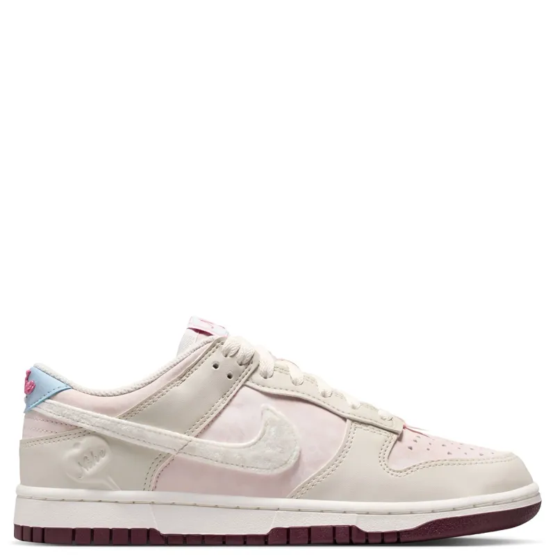 Medial side profile of Dunk Low in Light Bone and Silt Red with burgundy outsole