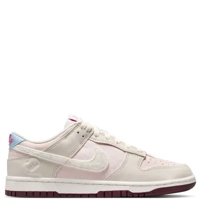 Medial side profile of Dunk Low in Light Bone and Silt Red with burgundy outsole