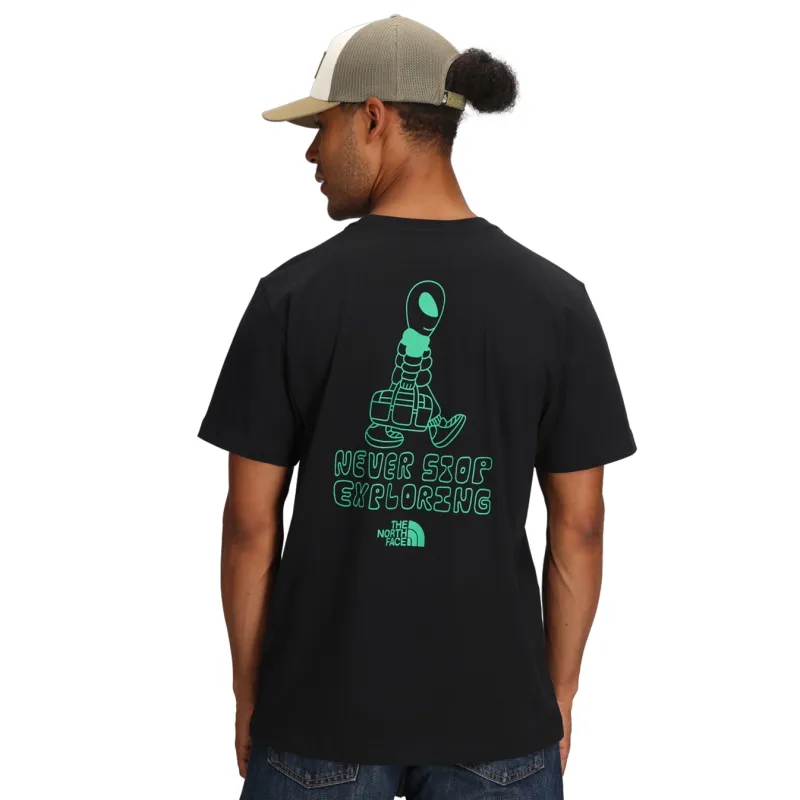 Back View Of The North Face Celestial Drift Tee In Black With Alien Character Graphic And Never Stop Exploring Text.