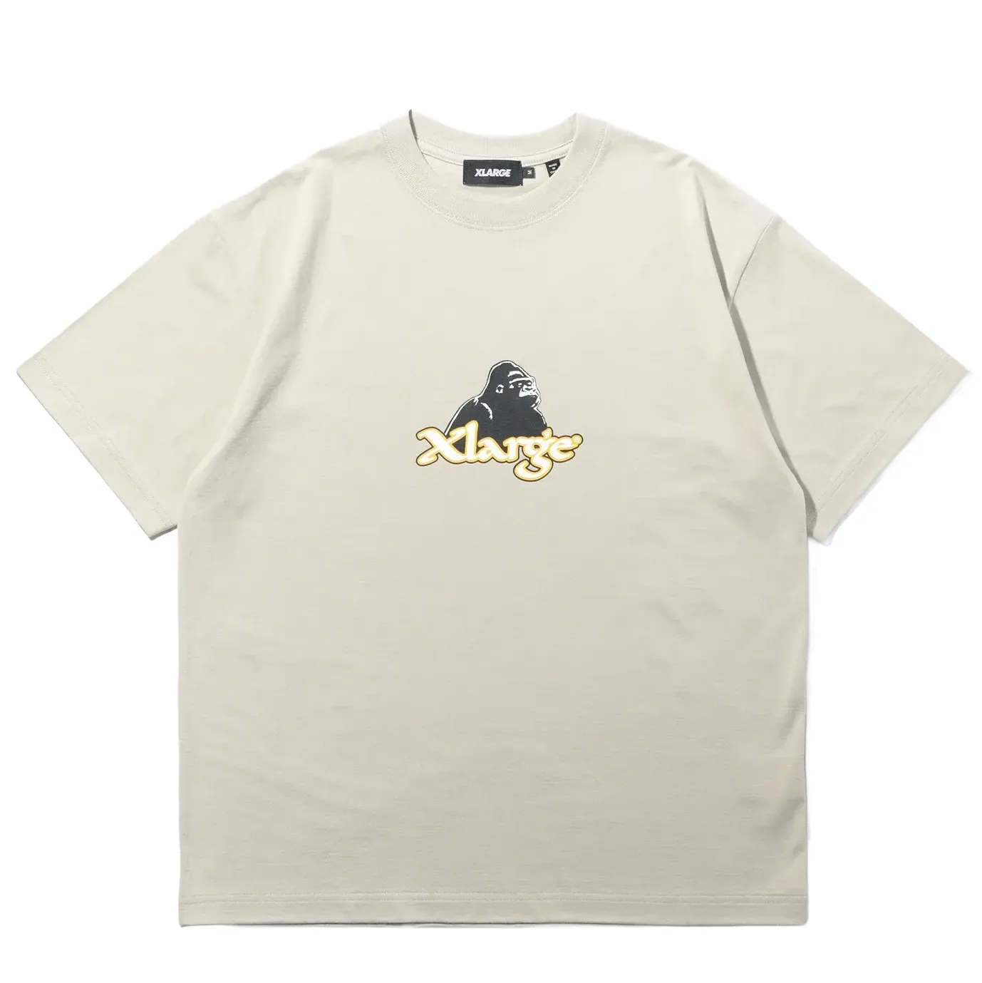 Front view of XLARGE Nu Age Logo tee in stone featuring gorilla graphic and gold script logo on soft cotton