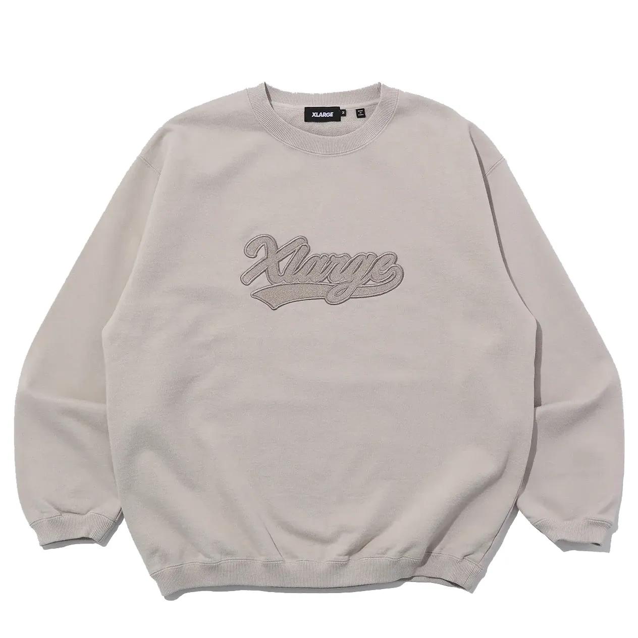 Front view of XLARGE Varsity Crewneck sweatshirt in stone with embroidered script logo on chest