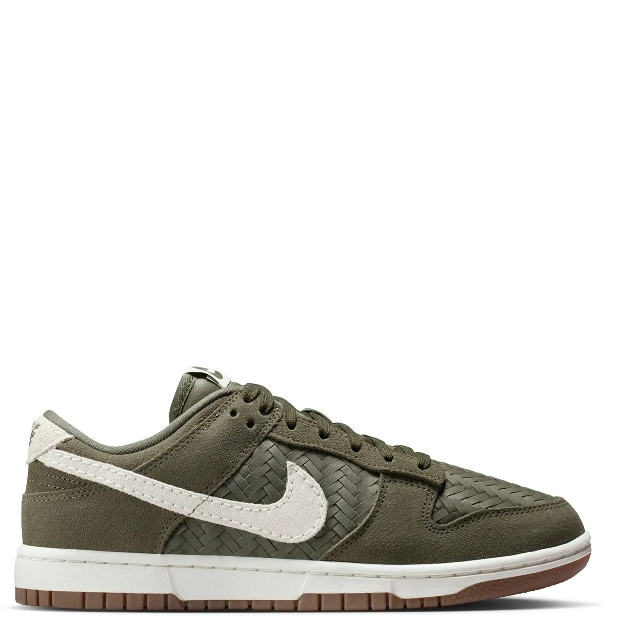 Medial side profile displaying textured woven upper and suede overlays