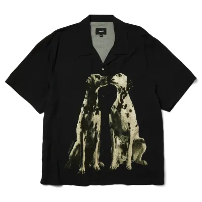 Front flat lay of HUF Dogged Resort Shirt in black featuring large Dalmatian dog graphic facing nose-to-nose.