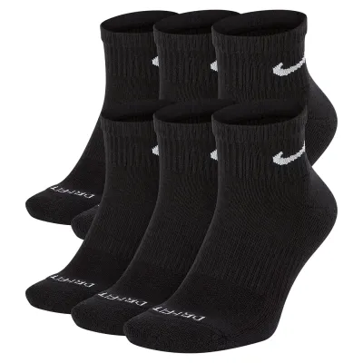 Six pairs of black Nike ankle socks with white Swoosh logos and cushioned Everyday Plus design.