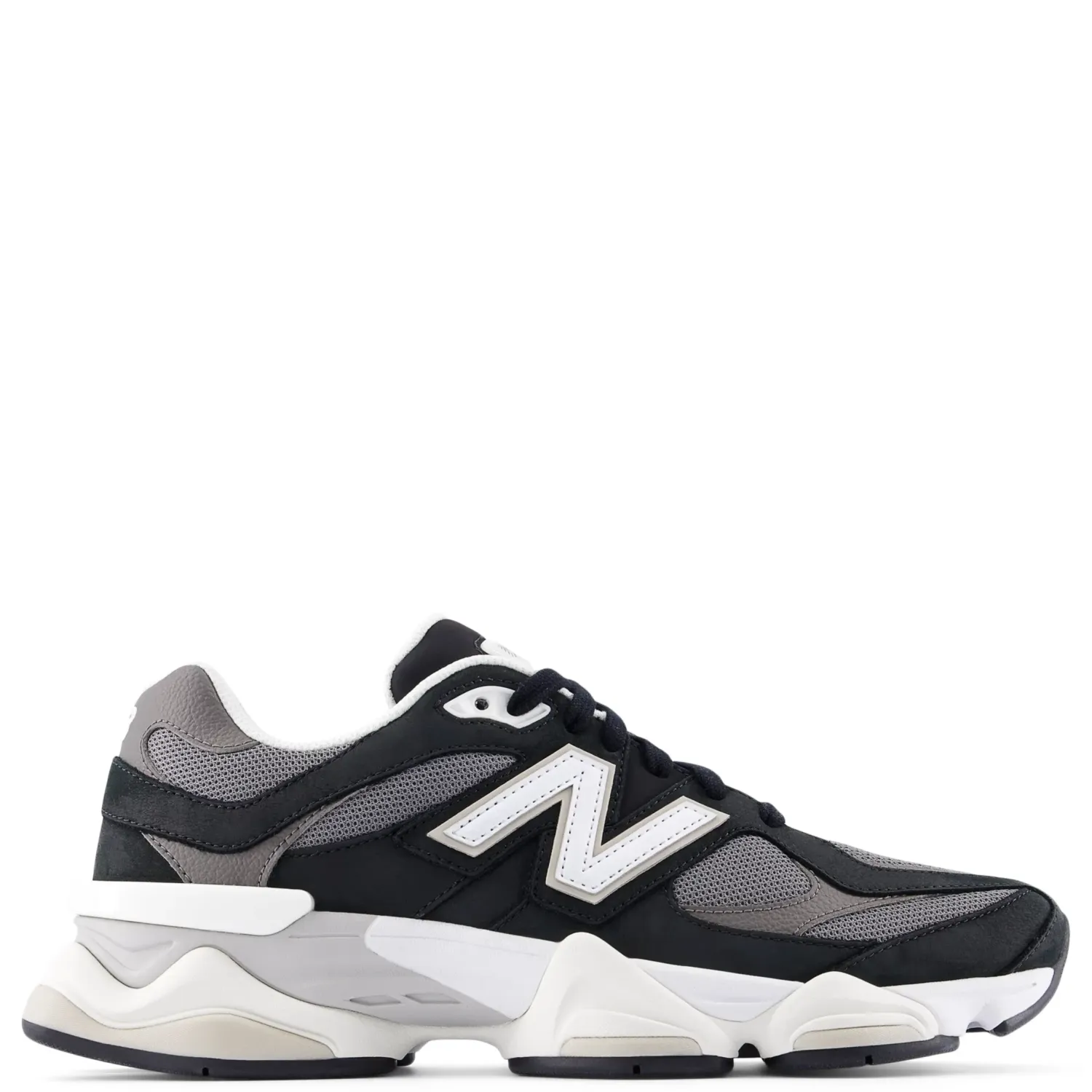 Lateral side view of New Balance 9060 sneaker in black and grey mesh with white “N” logo and chunky sculpted midsole.