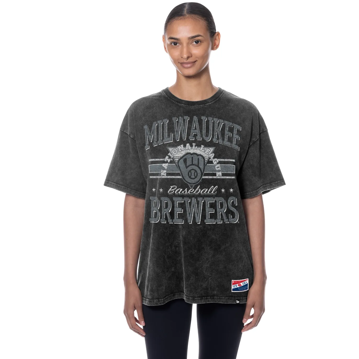 Model wearing Milwaukee Brewers stone wash tee with distressed retro baseball graphic, relaxed fit