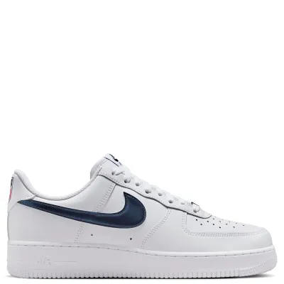 Medial side view of the Nike Air Force 1 Team USA featuring clean white leather panels and sleek navy Swoosh detail.