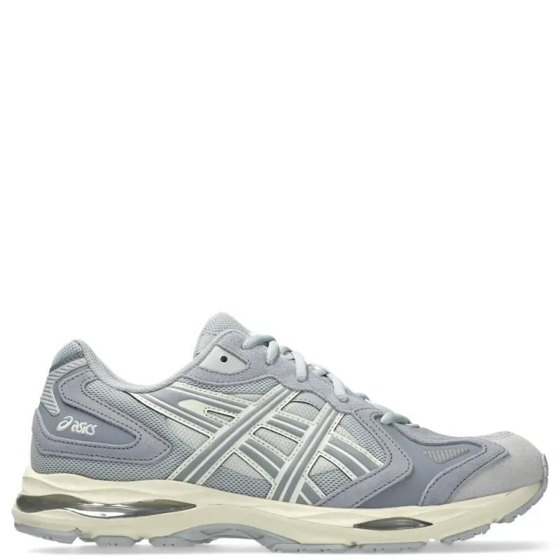 Side profile of ASICS GEL-K1011 emphasizing GEL cushioning, sculpted midsole, and durable outsole.