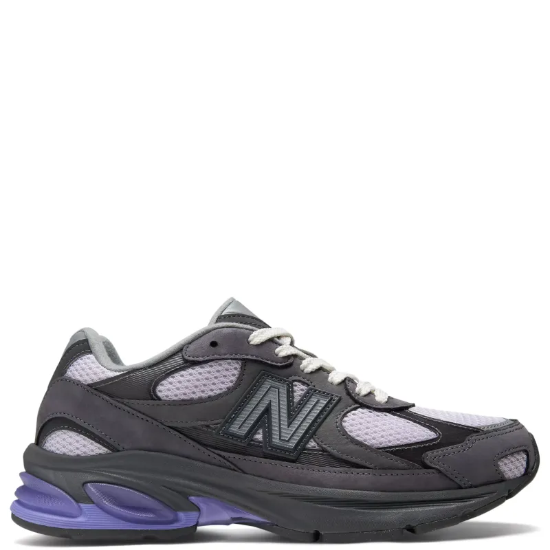 Lateral side view of New Balance ABZORB 2010 sneaker in grey and black with purple midsole accents and layered mesh upper.