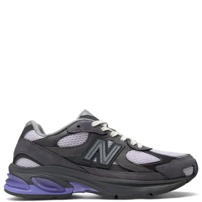 Lateral side view of New Balance ABZORB 2010 sneaker in grey and black with purple midsole accents and layered mesh upper.