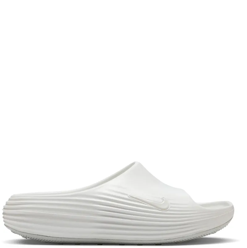 Lateral side view of sail slide with tonal Swoosh and textured ripple foam midsole design