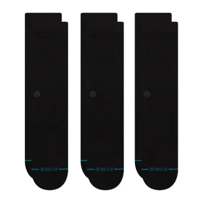 Top-down view of three pairs of black crew socks laid flat, highlighting ribbed texture and minimal design