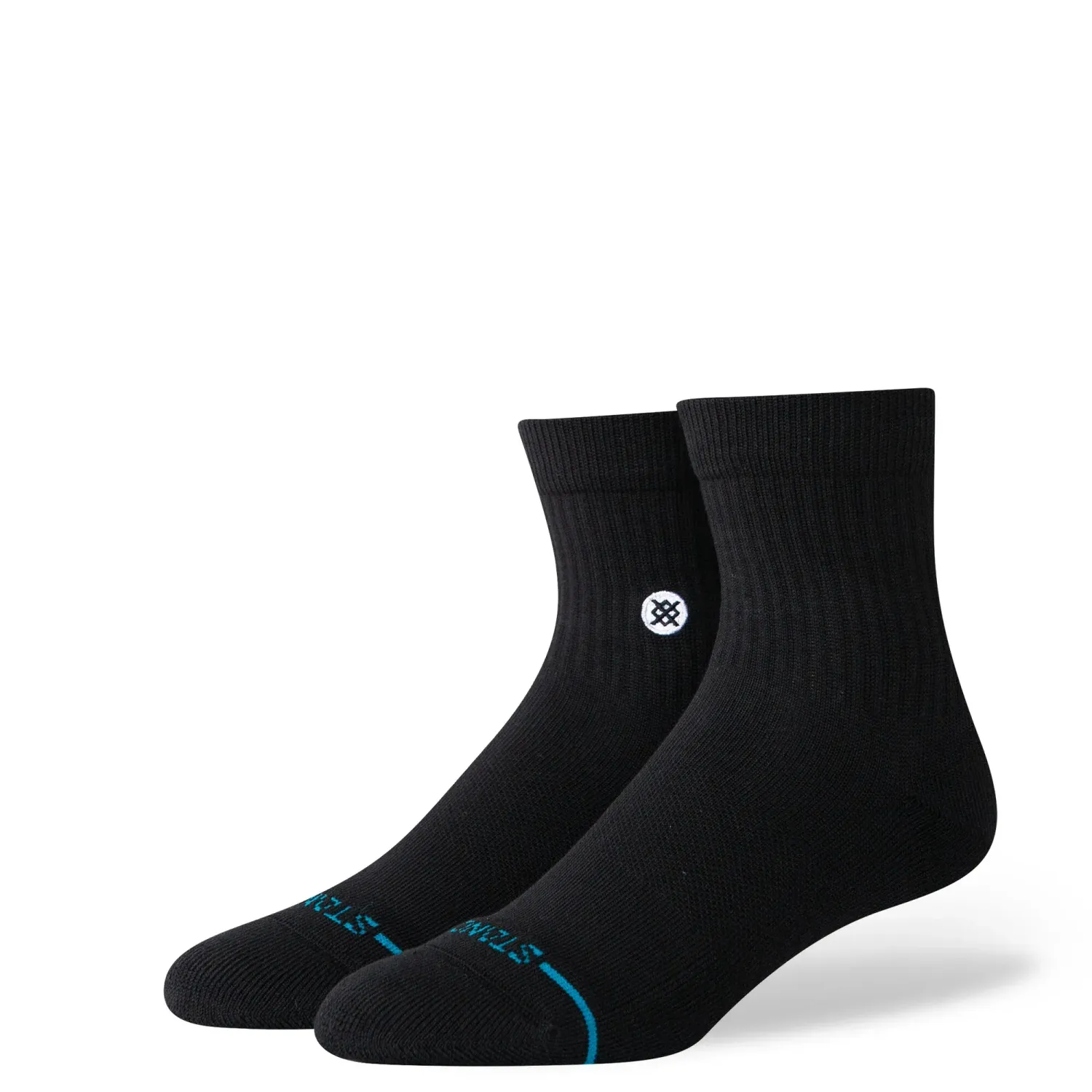 Angled view of black Stance quarter socks showing ribbed cuff, cushioned footbed, and logo detail on ankle