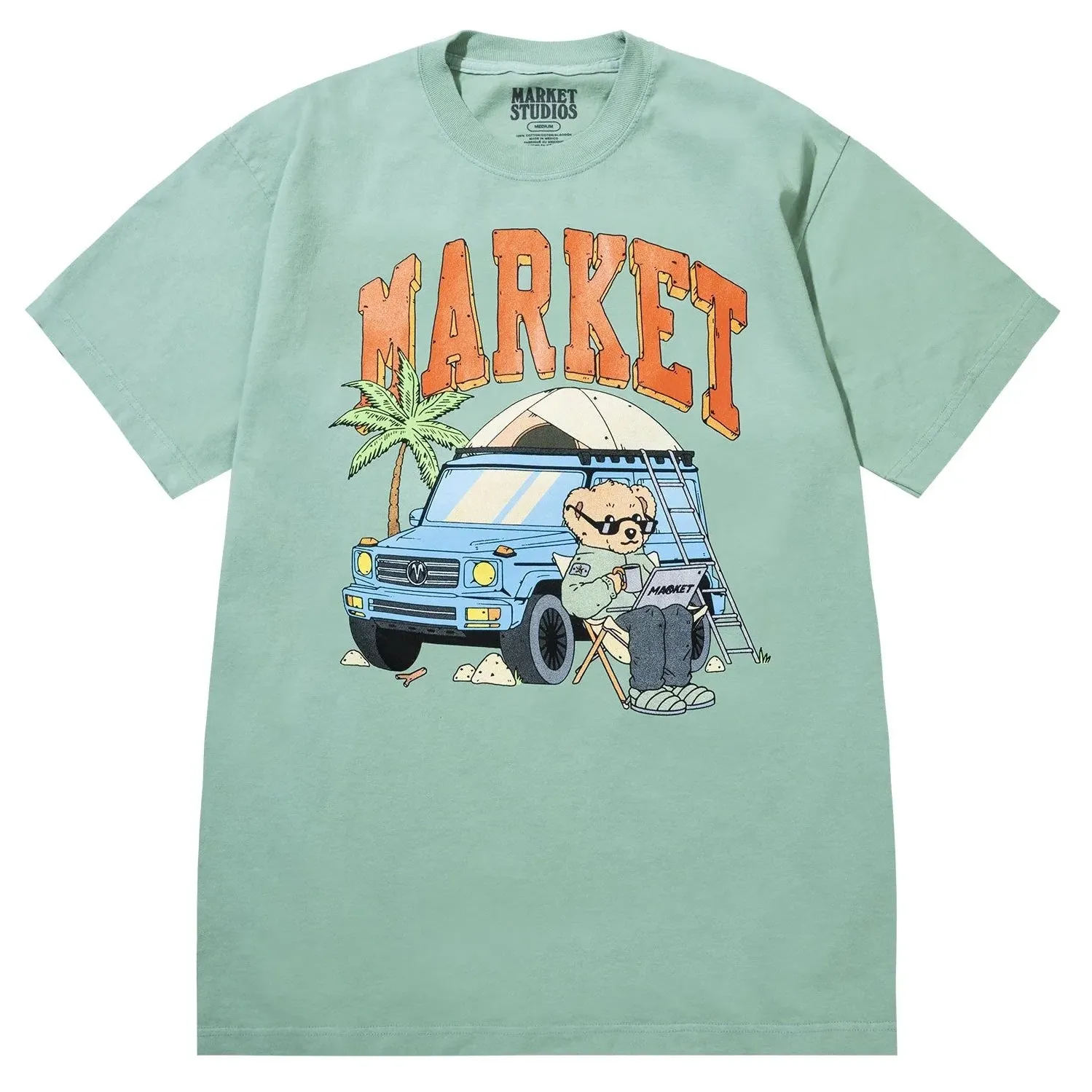 Front view of Market Studios green t-shirt with “MARKET” text and bear camping by SUV graphic
