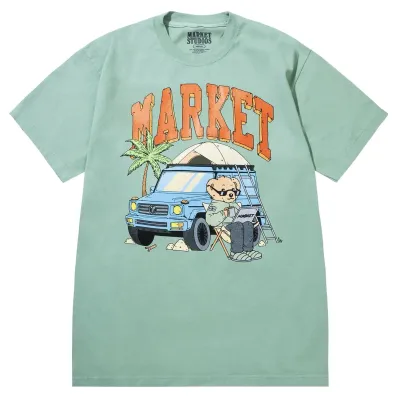 Front view of Market Studios green t-shirt with “MARKET” text and bear camping by SUV graphic
