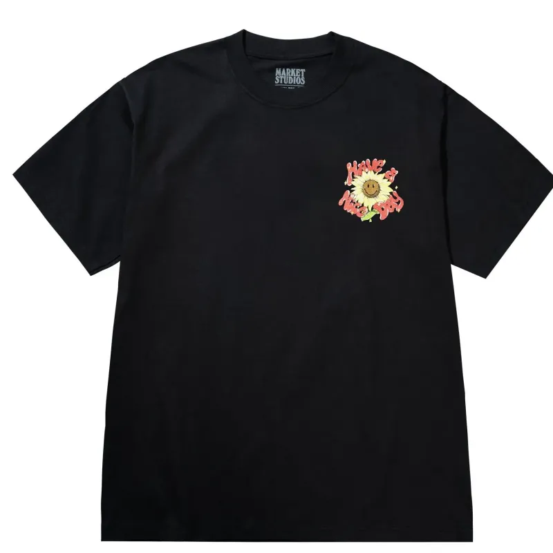 Front view of Market Studios black t-shirt with small sunflower “Have a Nice Day” graphic on chest