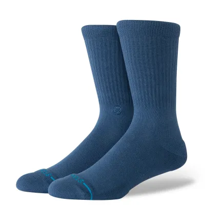 Pair of Stance Icon Crew Socks in deep teal shown from an angled front view with ribbed crew construction.