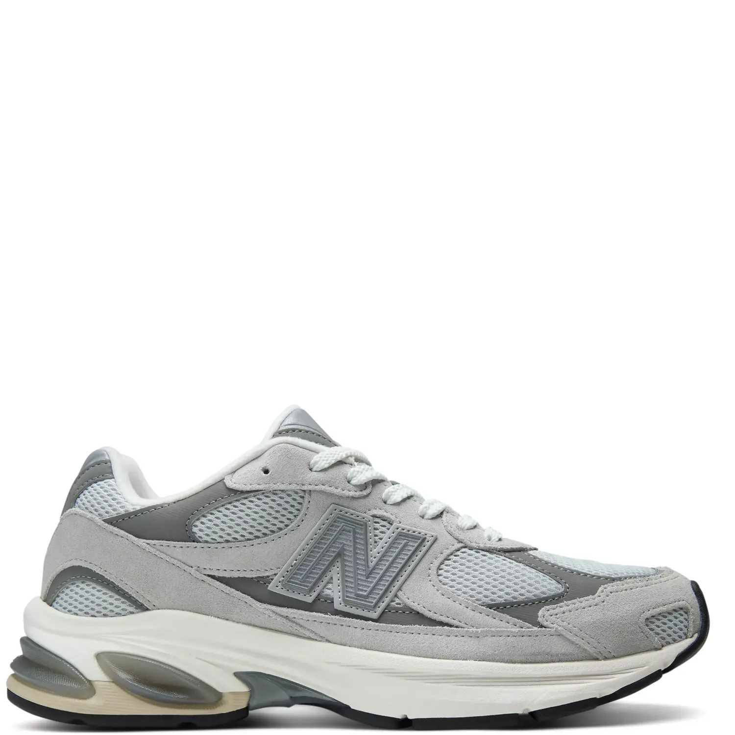 Side profile of the New Balance 2010 in Raincloud and Harbor Grey with suede overlays and segmented ABZORB sole
