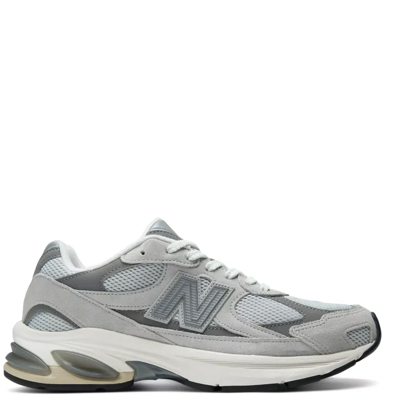 Side profile of the New Balance 2010 in Raincloud and Harbor Grey with suede overlays and segmented ABZORB sole