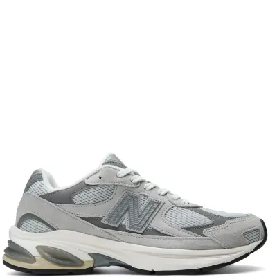 Side profile of the New Balance 2010 in Raincloud and Harbor Grey with suede overlays and segmented ABZORB sole