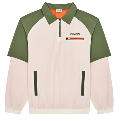 Flat lay of Malbon Marina windshirt in cream/olivine with zip pocket and elastic hem