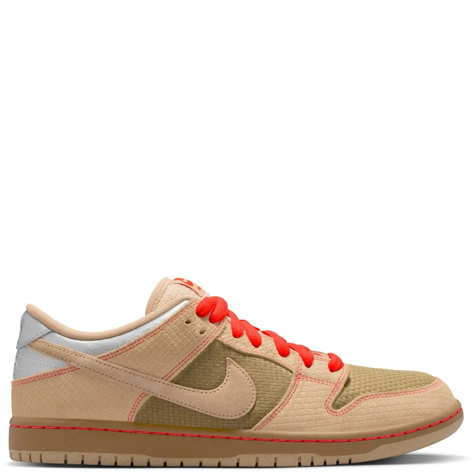 Side profile of the Nike SB Dunk Low Pro Som Tum in beige with woven textures and bright red-orange laces.