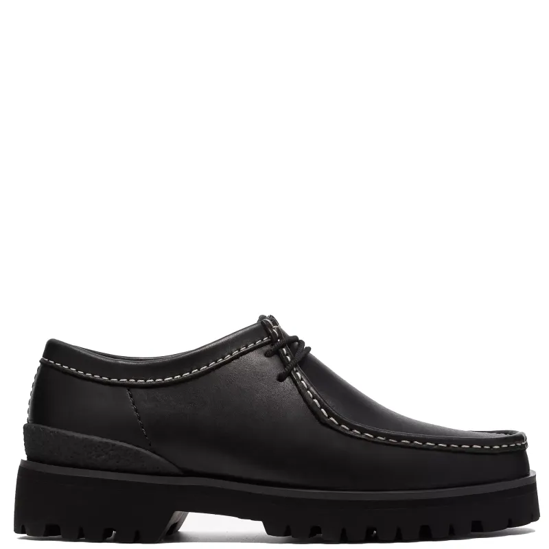 Clarks Walla Yukoner shoe in black leather side profile with contrast stitching and lug sole