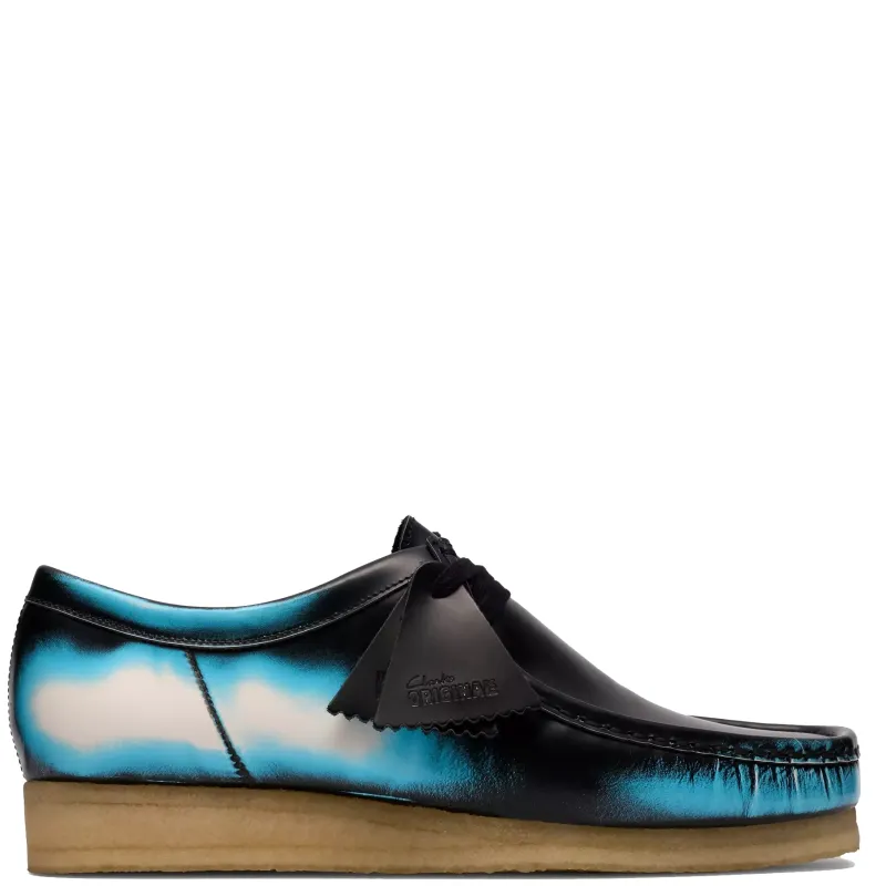 Clarks Wallabee in black brush off leather with blue gradient detailing and crepe sole side profile