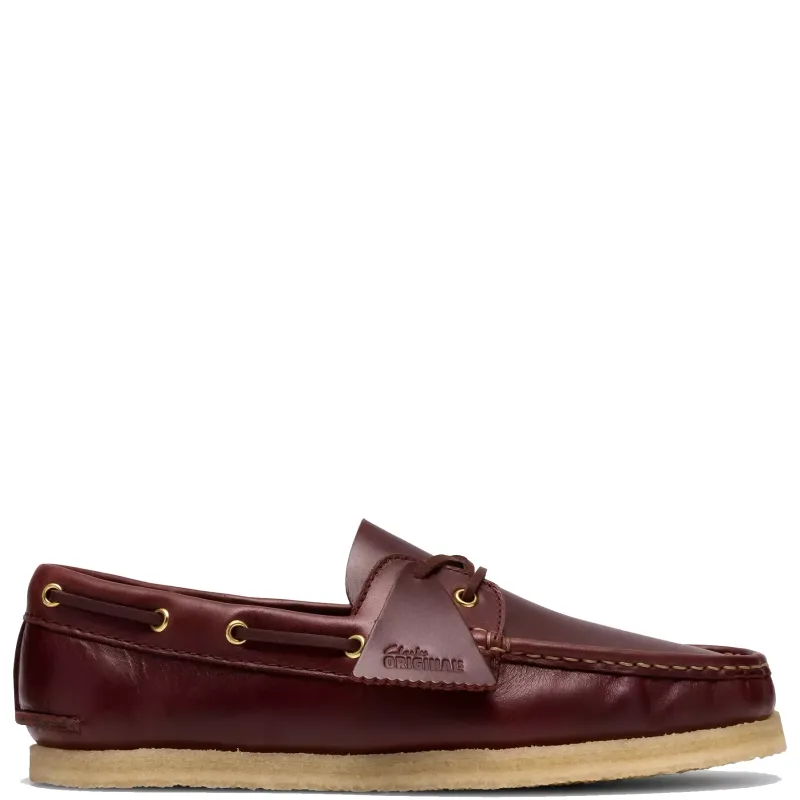 Side profile of Clarks Godney Boat in British tan leather with moc toe stitching and crepe sole