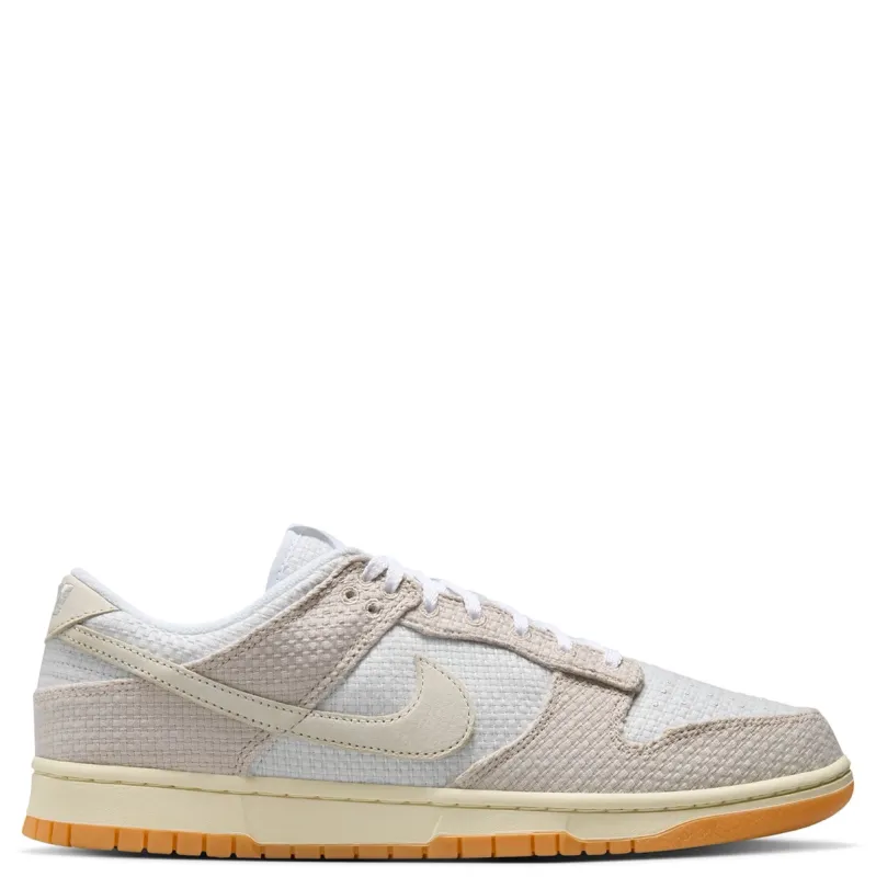 Nike Dunk Low Retro SE medial side view in neutral tones with woven paneling and low profile design