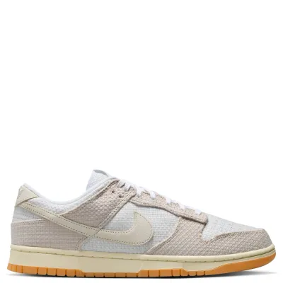 Nike Dunk Low Retro SE medial side view in neutral tones with woven paneling and low profile design