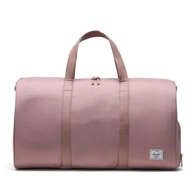 Front view of Herschel Novel duffle bag in ash rose with matching handles