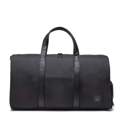 Front view of Herschel Novel duffle bag in black tonal with matching handles