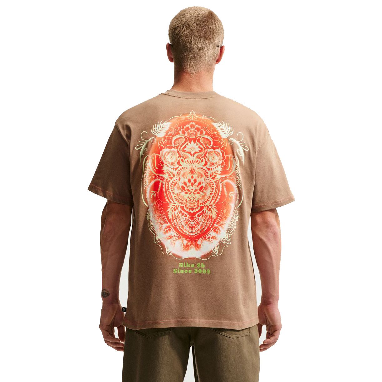 Back view of brown Nike SB t-shirt with large intricate red and white graphic design