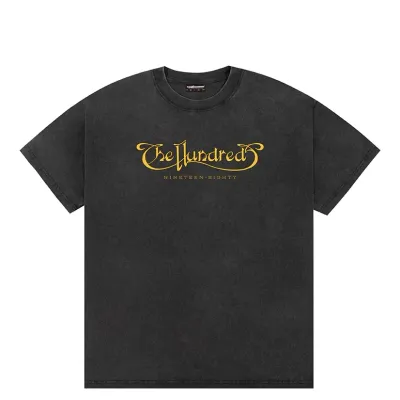 Front view of washed black t-shirt with gold The Hundreds script logo graphic
