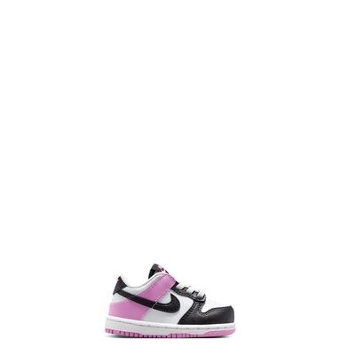 Side profile of toddler Nike Dunk Low highlighting color-blocked design with pink heel and black Swoosh