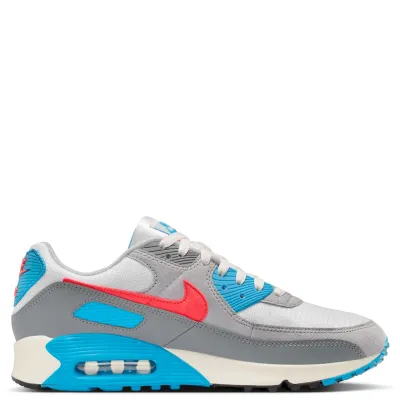 Medial side profile with grey suede and mesh construction and blue midsole accents