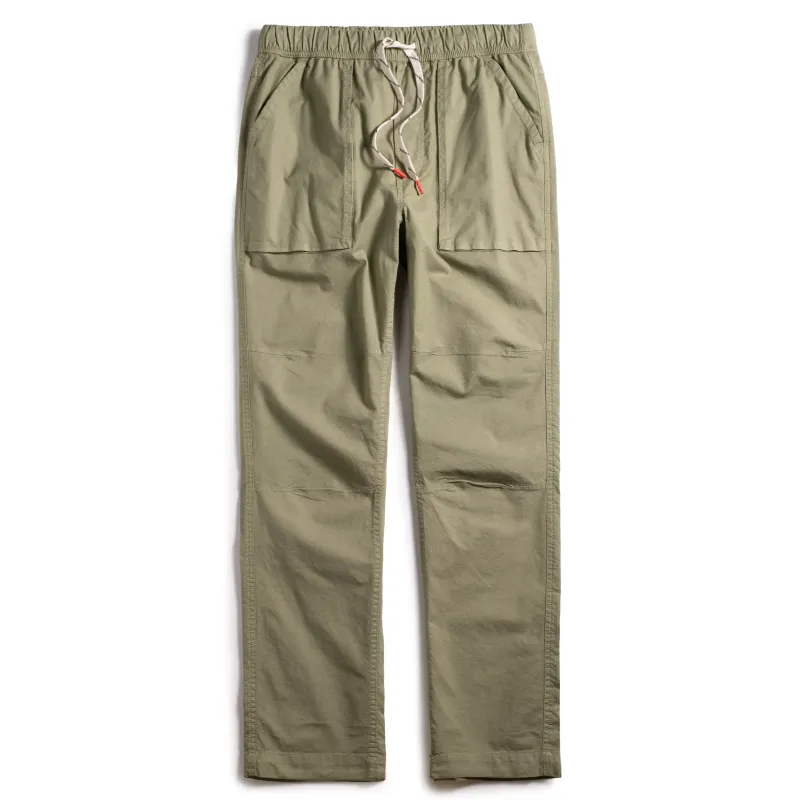 Front view of TOPO DESIGNS Desert Pants in oil green with drawcord waist and articulated knees