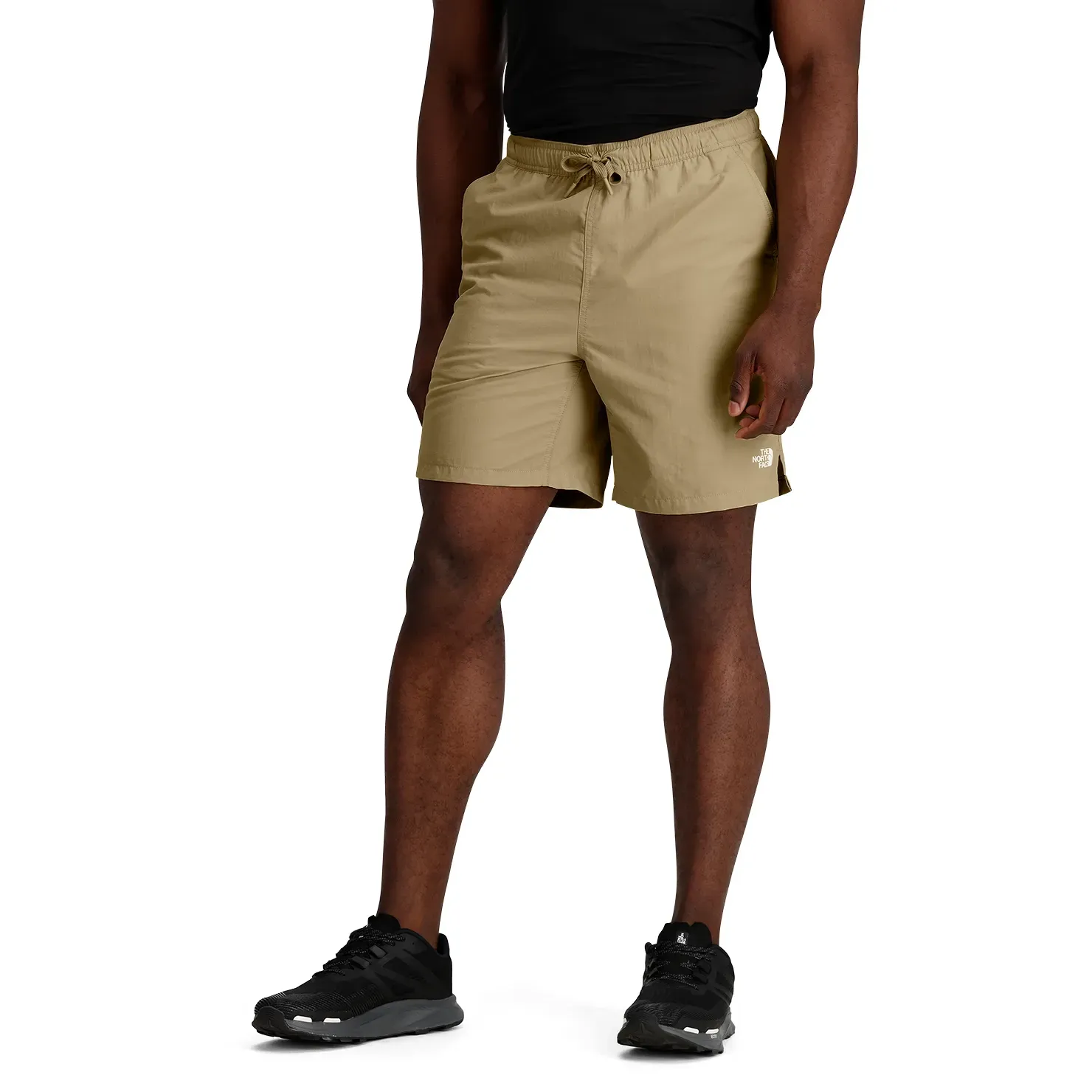 Model wearing The North Face Action 2.0 Shorts with split hem detail