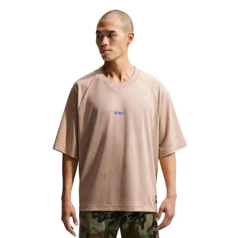 Front view of Nike SB Jacquard Doodle Jersey featuring relaxed fit and woven doodle texture