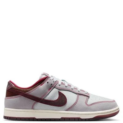 Medial side profile of Nike Dunk Low Retro SE with contrast stitching