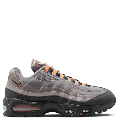 Medial side view of Nike Air Max 95 featuring layered suede textures and visible forefoot Air units