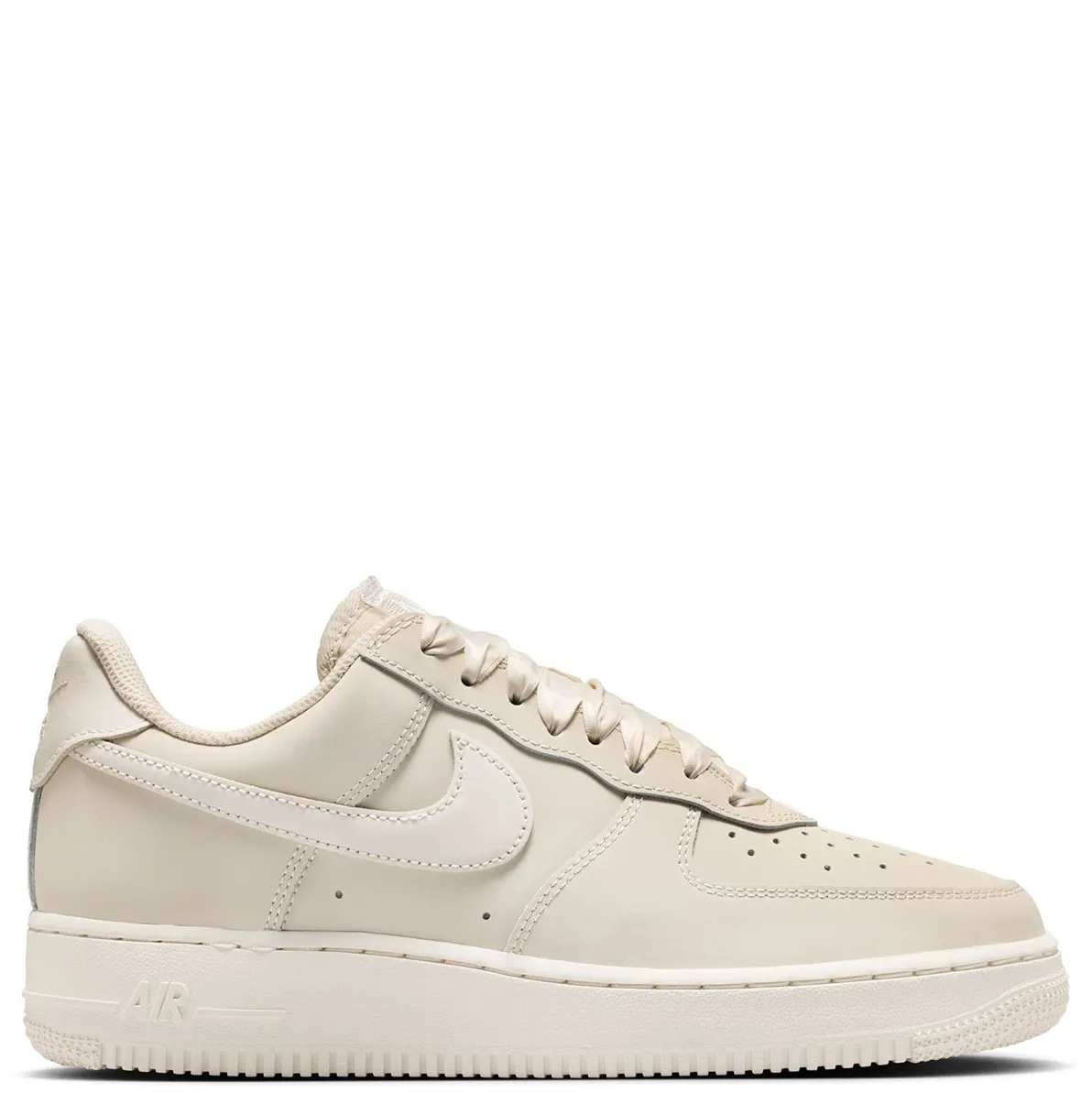 Full lateral side view of Nike Air Force 1 Retro Premium sneakers in soft neutral tones